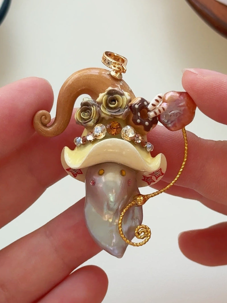 [PIECE04] Donut Dream Sprite baroque pearl necklace with donut-inspired hat, sculpted frosted donut, pastel roses, sparkling stones, playful dessert details, and natural baroque pearl