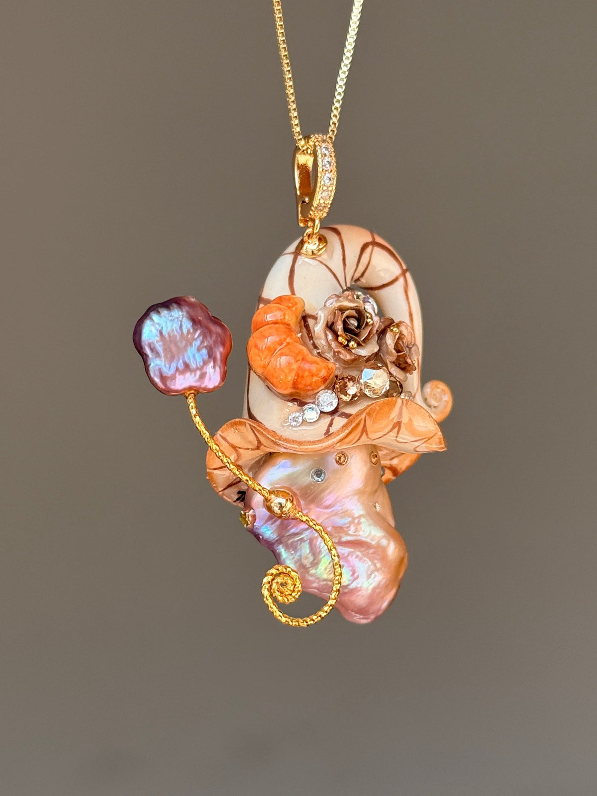 [PIECE01] Bakery Sprite baroque pearl necklace with peach croissant-inspired hat, sculpted croissant detail, brown floral accents, gold wand, and natural baroque pearl