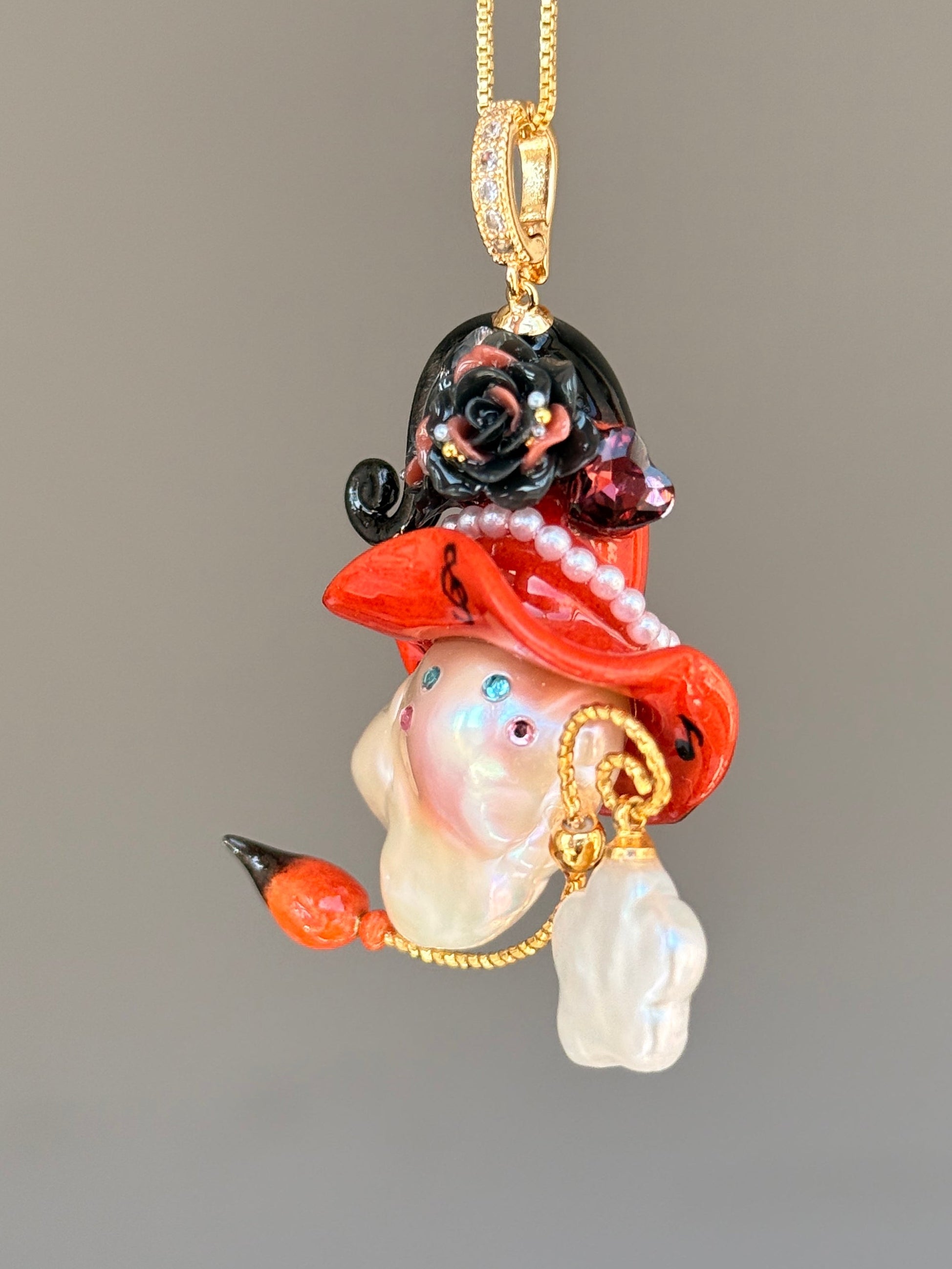 PIECE01 Crimson Riff Sprite baroque pearl necklace with red music-note hat, black roses and guitar-inspired back detail