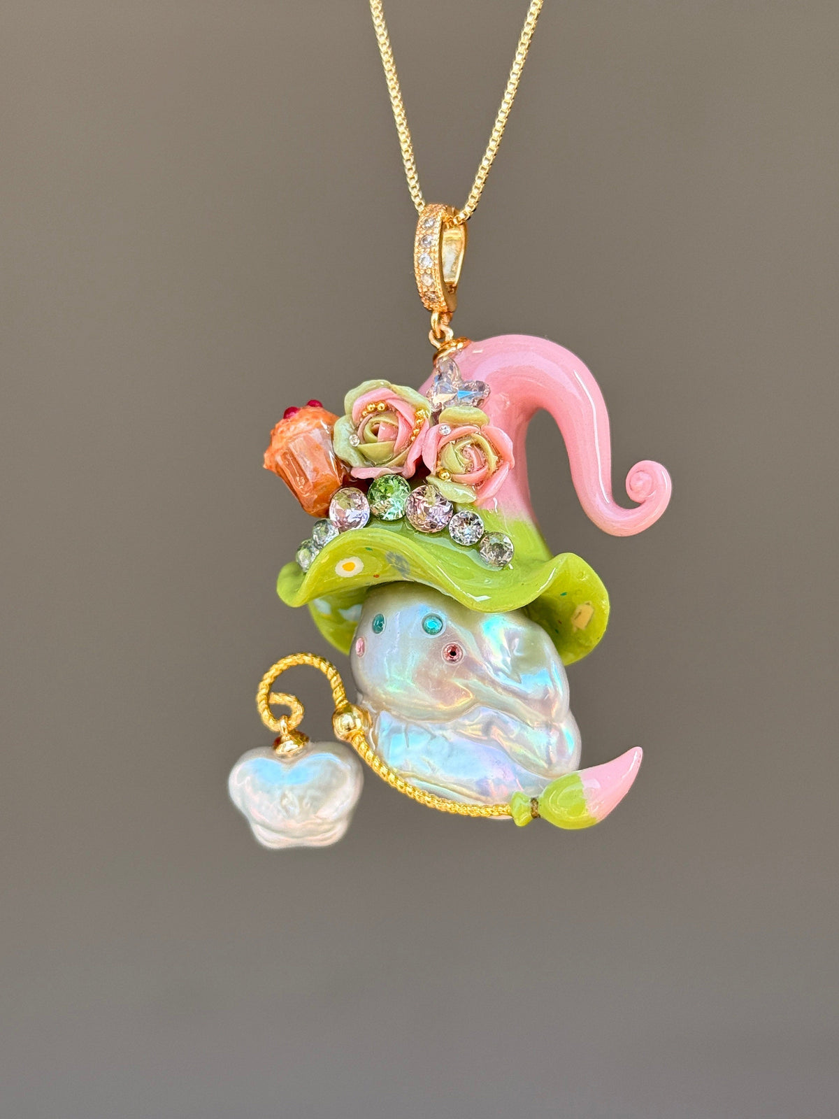 [PIECE01] Muffin Sprite baroque pearl necklace with pastel blue hat, soft yellow curl, sculpted orange muffin detail, mint floral accents, sparkling crystals, gold wand, and natural baroque pearl