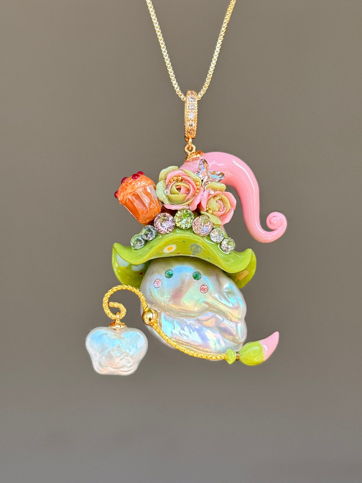 [PIECE01] Muffin Sprite baroque pearl necklace with pastel blue hat, soft yellow curl, sculpted orange muffin detail, mint floral accents, sparkling crystals, gold wand, and natural baroque pearl