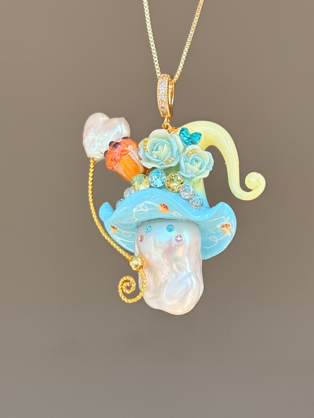 [PIECE04] Muffin Sprite baroque pearl necklace with muffin-inspired hat, pastel floral details, sparkling accents, gold wand, and natural baroque pearl