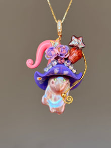 [PIECE05] Muffin Sprite baroque pearl necklace with pastel blue hat, soft yellow curl, sculpted orange muffin detail, mint floral accents, sparkling crystals, gold wand, and natural baroque pearl