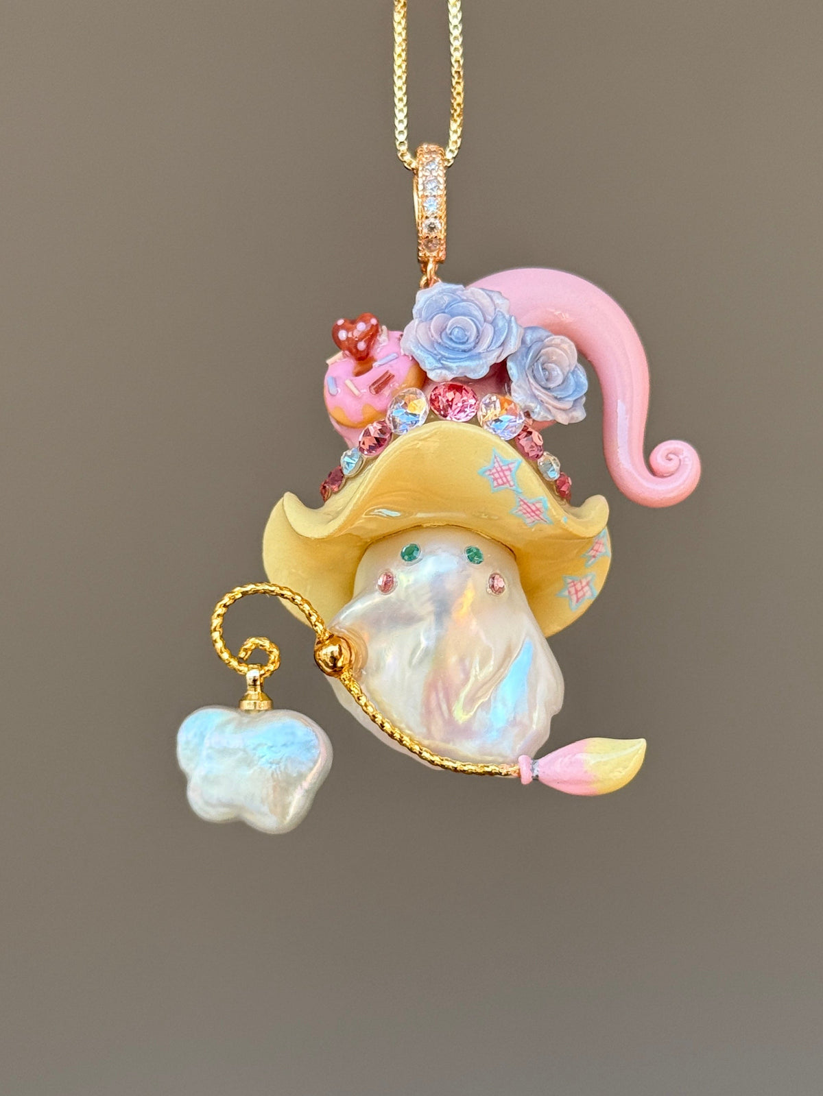 [PIECE03] Donut Dream Sprite baroque pearl necklace with donut-inspired hat, sculpted frosted donut, pastel roses, sparkling stones, playful dessert details, and natural baroque pearl