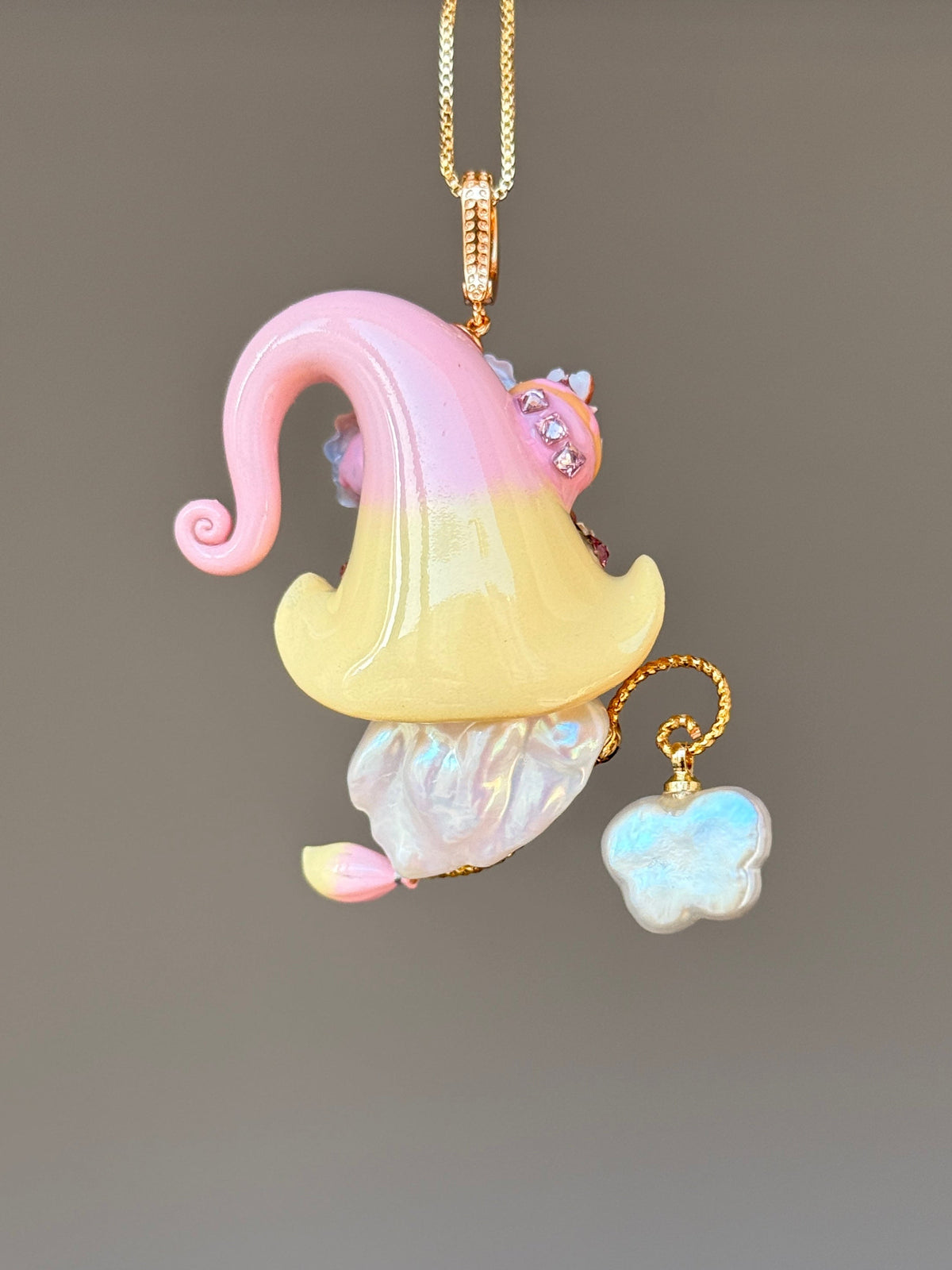 [PIECE03] Donut Dream Sprite baroque pearl necklace with donut-inspired hat, sculpted frosted donut, pastel roses, sparkling stones, playful dessert details, and natural baroque pearl