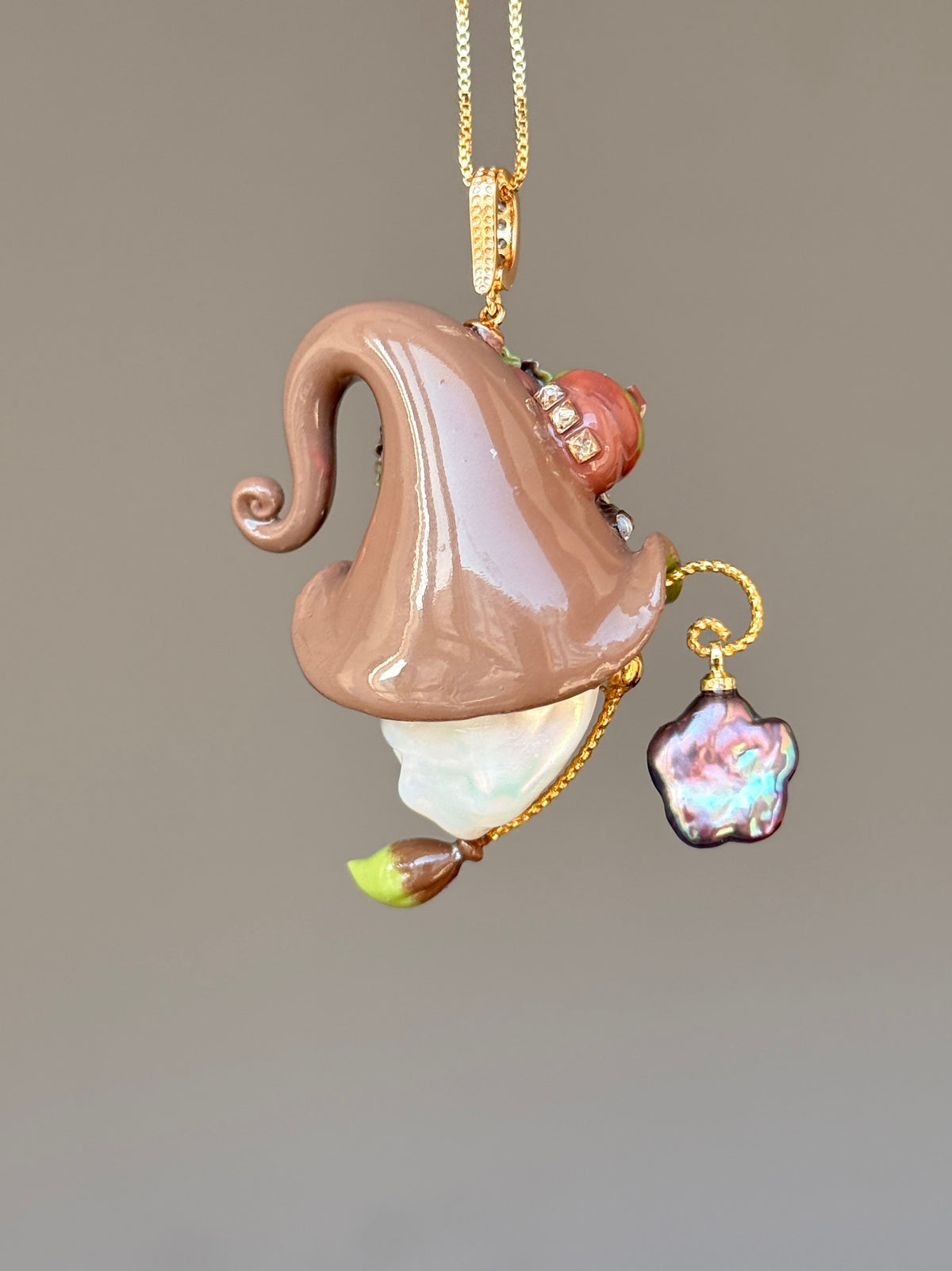 [PIECE01] Donut Dream Sprite baroque pearl necklace with yellow donut-inspired hat, sculpted pink frosted donut, pastel roses, sparkling stones, star details, pink curled accent, pearl charm, paintbrush detail, and natural baroque pearl