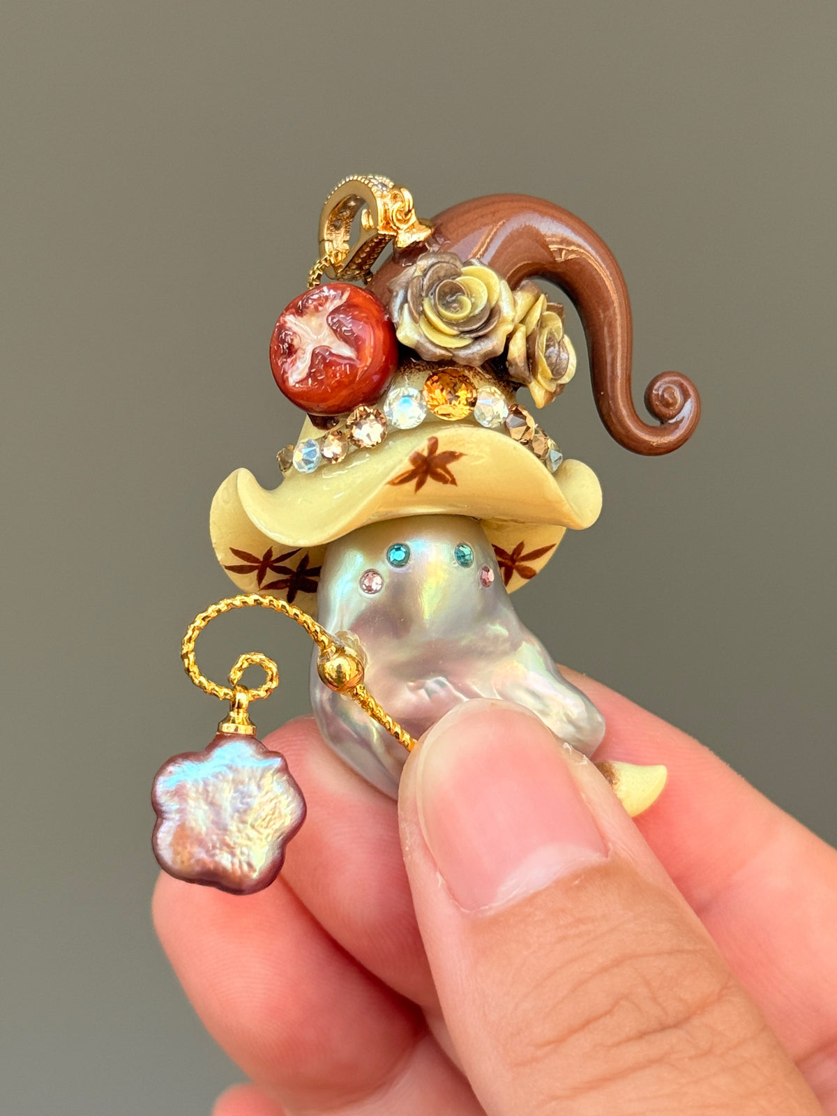 [PIECE06] Bakery Sprite baroque pearl necklace with cream pretzel bread-inspired hat, sculpted lye bread detail, floral accents, gold wand, and natural baroque pearl