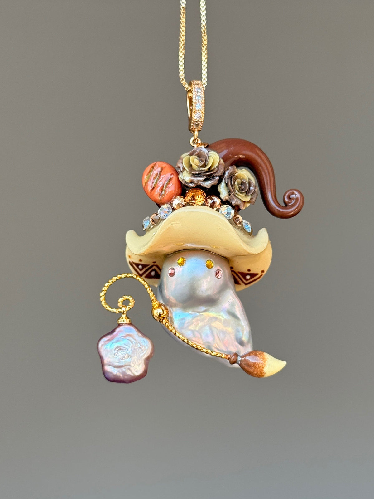 [PIECE08] Bakery Sprite baroque pearl necklace with artisan roll-inspired hat, sculpted bread detail, floral accents, gold wand, and natural baroque pearl