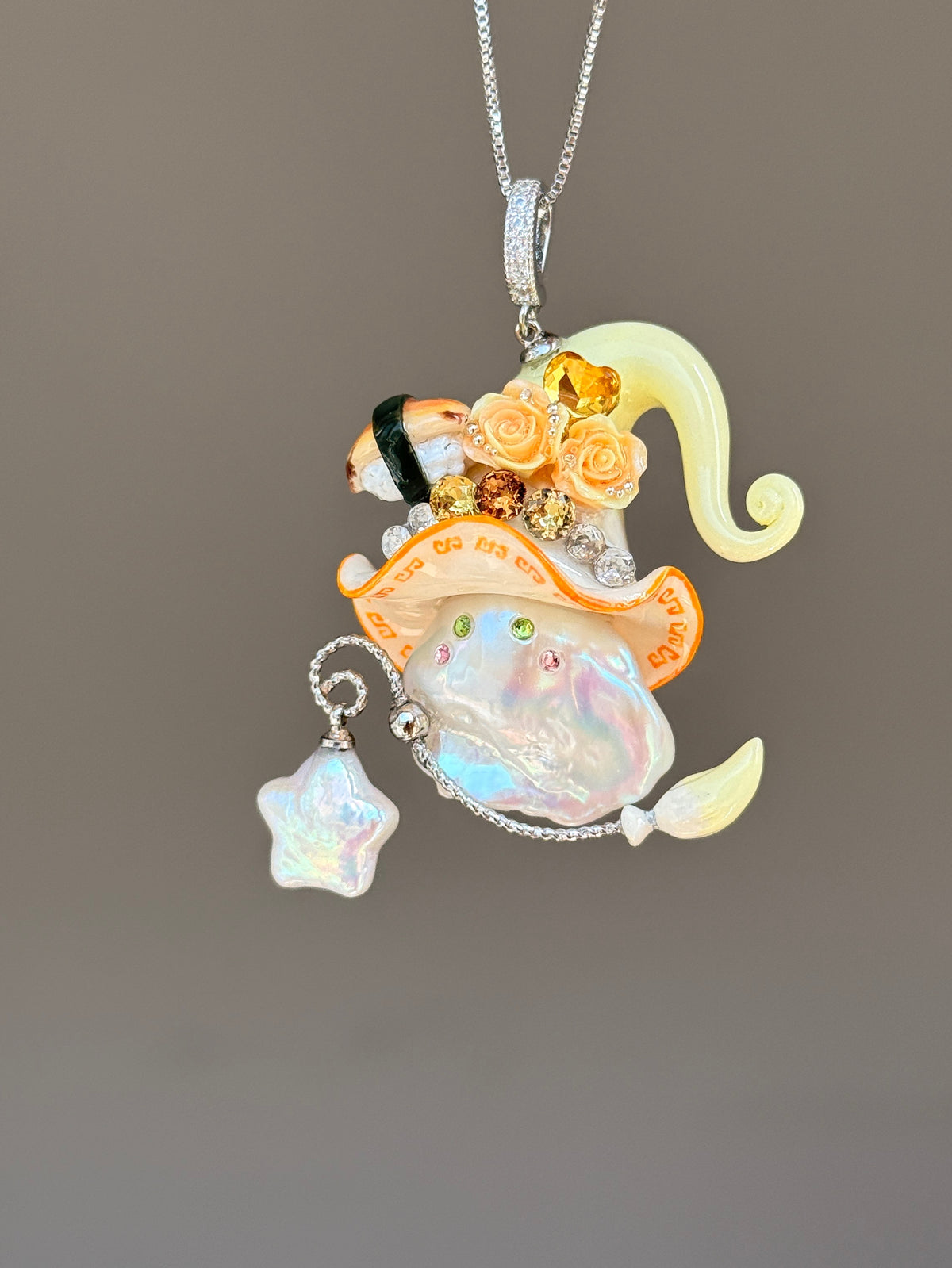 [PIECE04] Sushi Sprite baroque pearl necklace with sushi-inspired hat, sculpted sushi detail, blue floral accents, sparkling stones, dangling charm, and natural baroque pearl