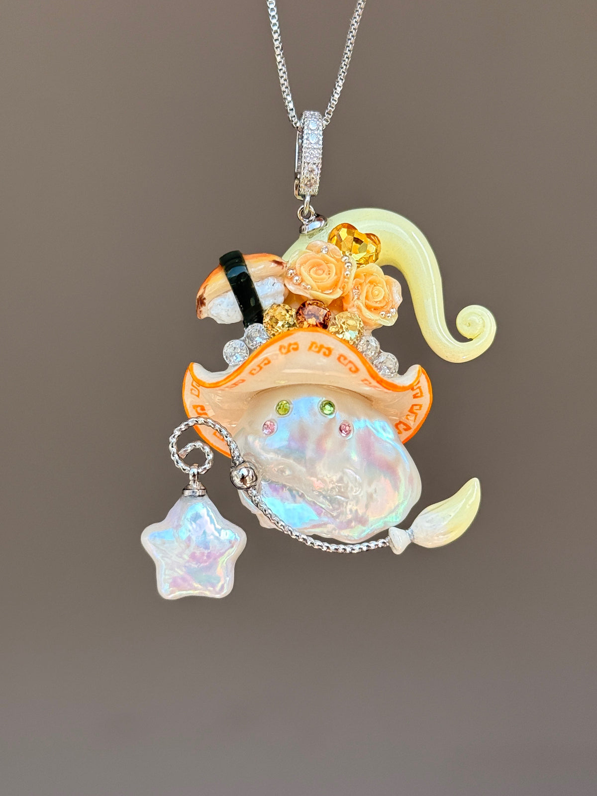 [PIECE04] Sushi Sprite baroque pearl necklace with sushi-inspired hat, sculpted sushi detail, blue floral accents, sparkling stones, dangling charm, and natural baroque pearl