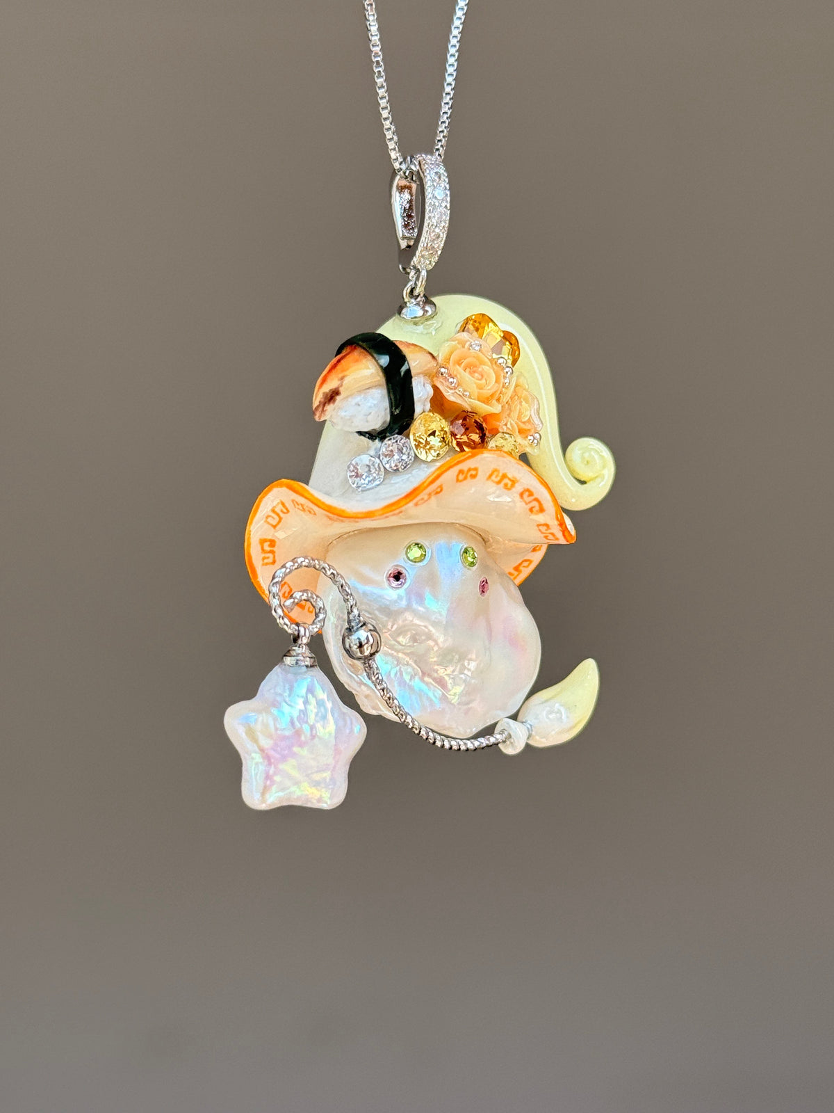 [PIECE04] Sushi Sprite baroque pearl necklace with sushi-inspired hat, sculpted sushi detail, blue floral accents, sparkling stones, dangling charm, and natural baroque pearl