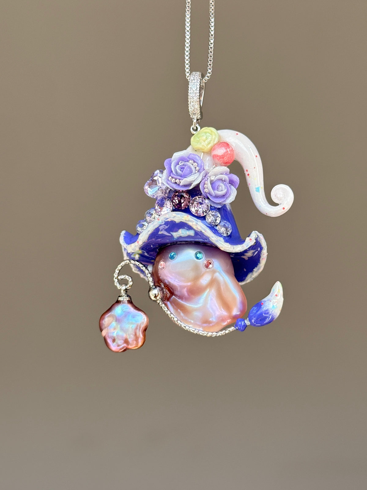[PIECE01] Lollipop Sprite baroque pearl necklace with a curled mini hat, sculpted candy details, floral accents, sparkling crystals, a dangling charm, and natural baroque pearl