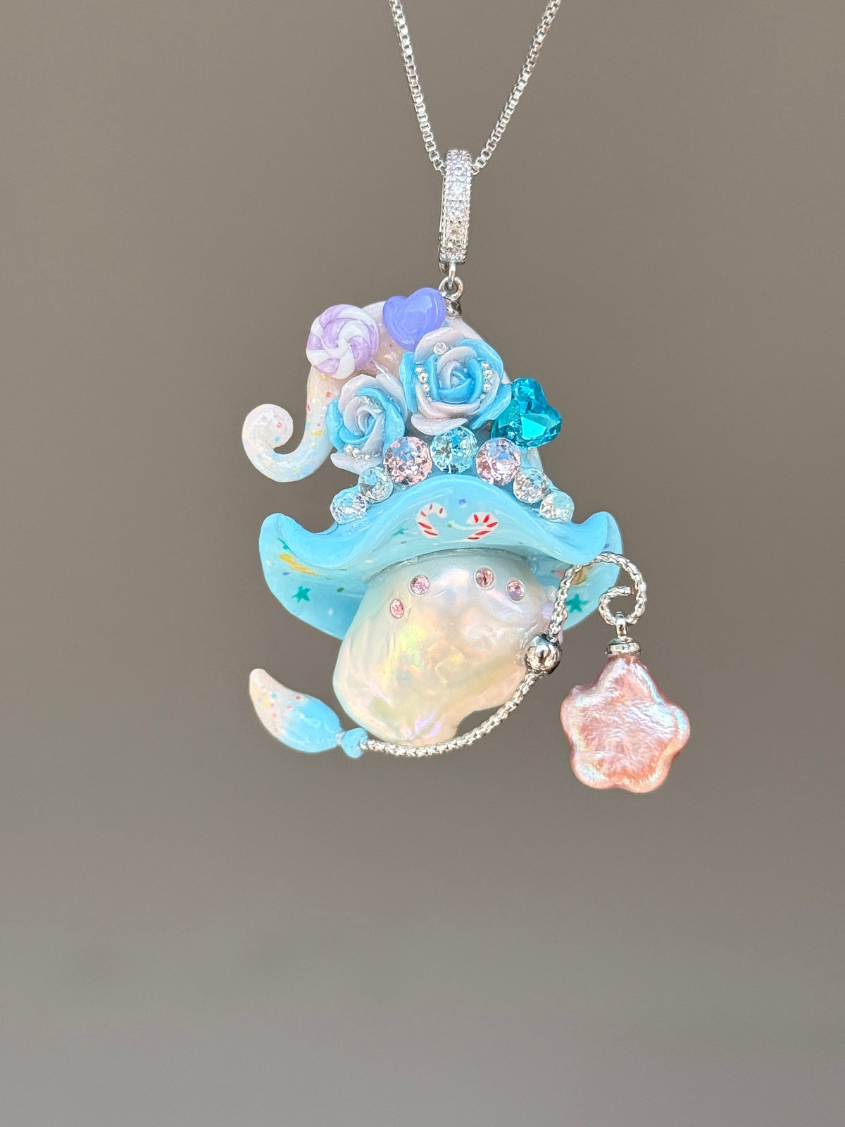 [PIECE03] Lollipop Sprite baroque pearl necklace with a curled mini hat, sculpted candy details, floral accents, sparkling crystals, a dangling charm, and natural baroque pearl