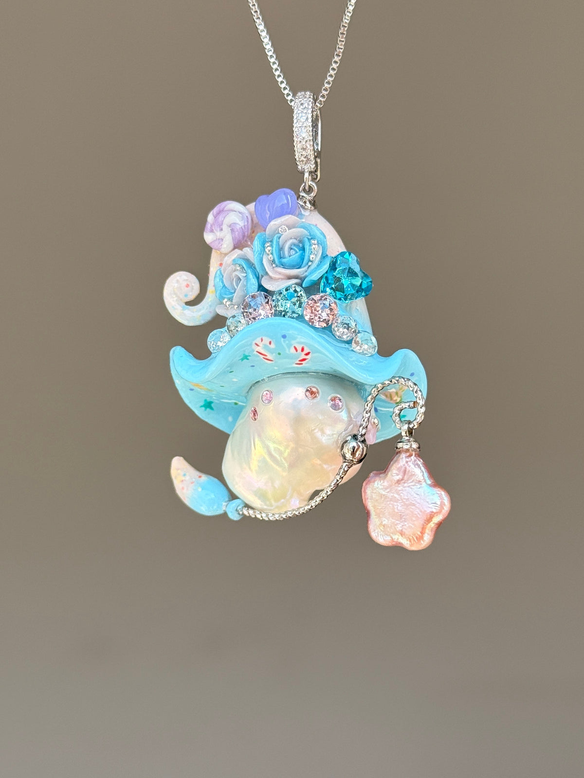 [PIECE03] Lollipop Sprite baroque pearl necklace with a curled mini hat, sculpted candy details, floral accents, sparkling crystals, a dangling charm, and natural baroque pearl
