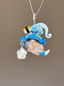 [PIECE02] Sushi Sprite baroque pearl necklace with sushi-inspired hat, sculpted sushi detail, blue floral accents, sparkling stones, dangling charm, and natural baroque pearl