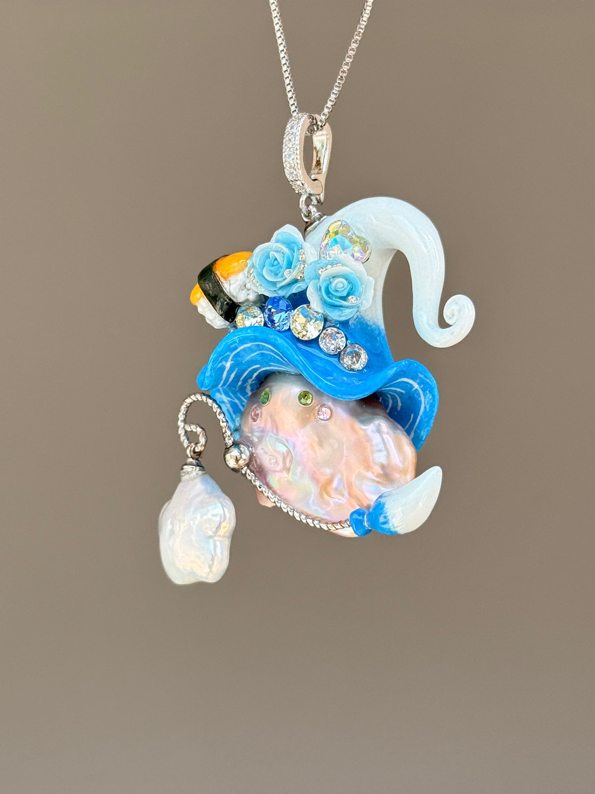 [PIECE02] Sushi Sprite baroque pearl necklace with sushi-inspired hat, sculpted sushi detail, blue floral accents, sparkling stones, dangling charm, and natural baroque pearl