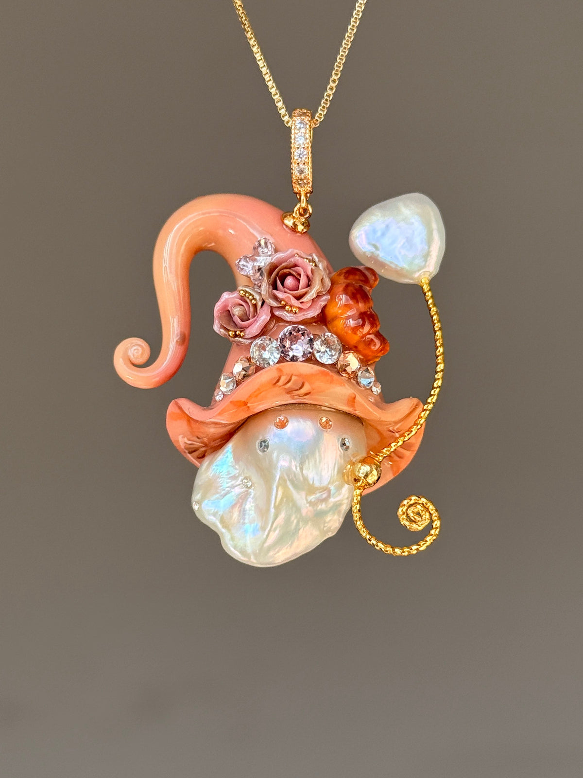 [PIECE05] Bakery Sprite baroque pearl necklace with coral croissant-inspired hat, sculpted pastry detail, rose accents, gold wand, and natural baroque pearl