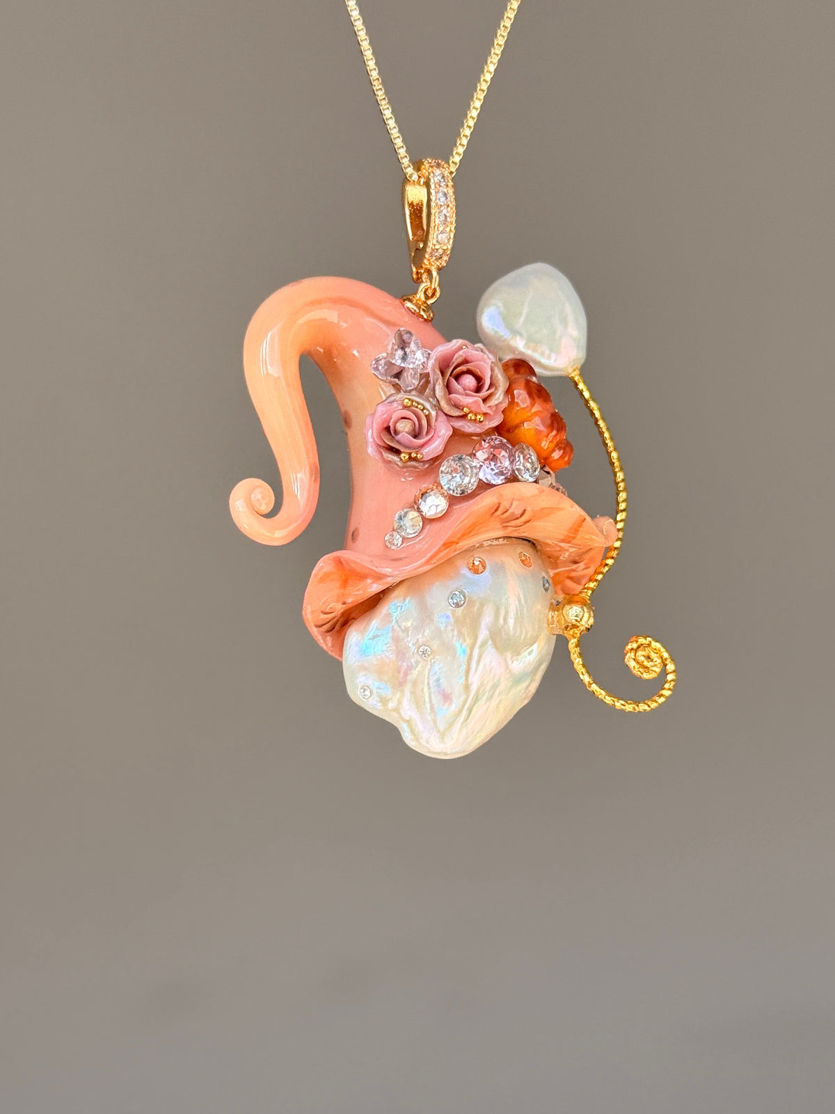[PIECE05] Bakery Sprite baroque pearl necklace with coral croissant-inspired hat, sculpted pastry detail, rose accents, gold wand, and natural baroque pearl