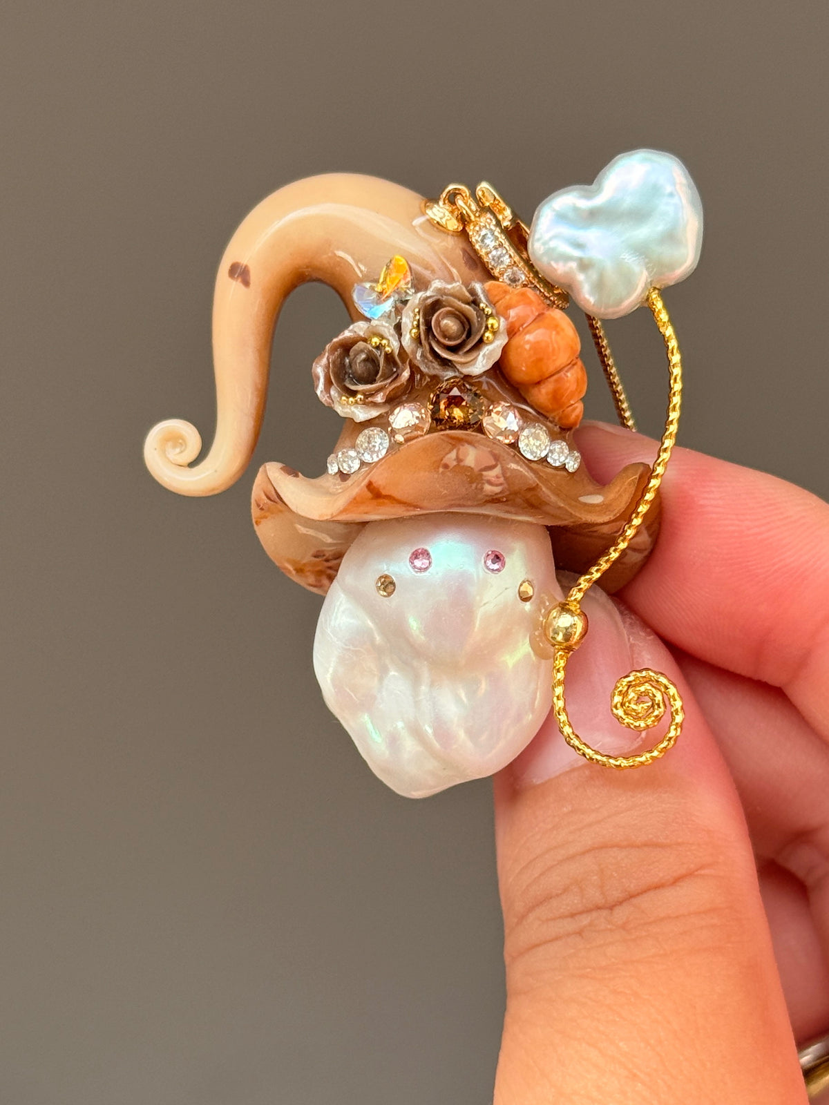 [PIECE04] Bakery Sprite baroque pearl necklace with peach croissant-inspired hat, sculpted croissant detail, brown floral accents, gold wand, and natural baroque pearl
