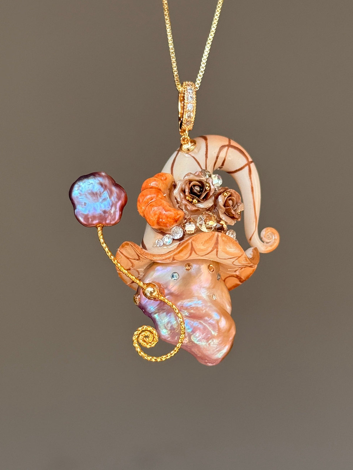 [PIECE01] Bakery Sprite baroque pearl necklace with peach croissant-inspired hat, sculpted croissant detail, brown floral accents, gold wand, and natural baroque pearl