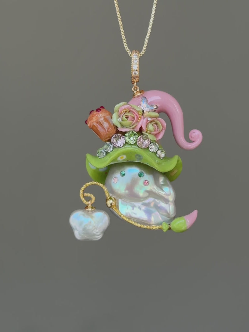 [PIECE01] Muffin Sprite baroque pearl necklace with pastel blue hat, soft yellow curl, sculpted orange muffin detail, mint floral accents, sparkling crystals, gold wand, and natural baroque pearl